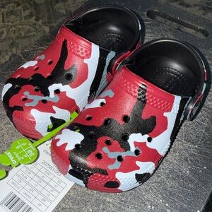 Crocs Classic Printed Camo Clogs in a black and red colorway